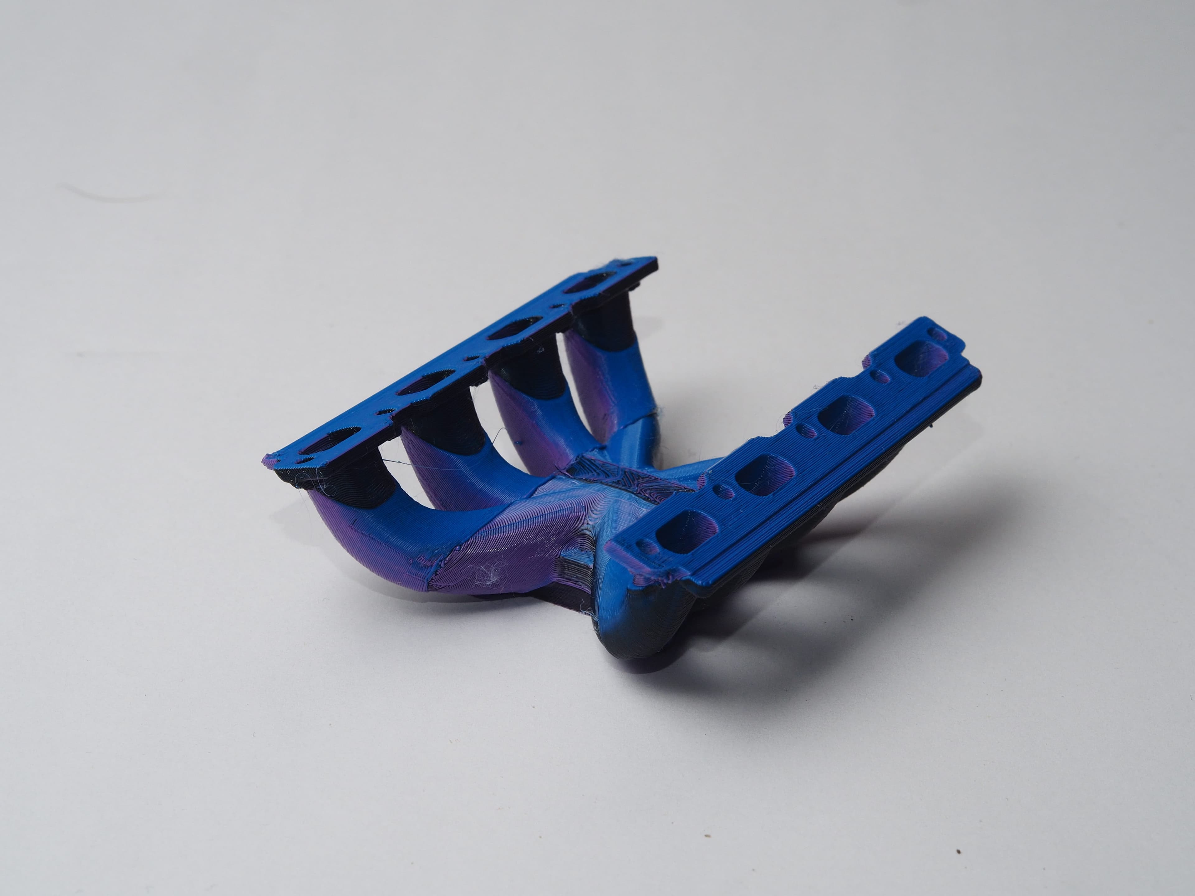 An intake manifold model with internal channels, 5-axis printed without supports
